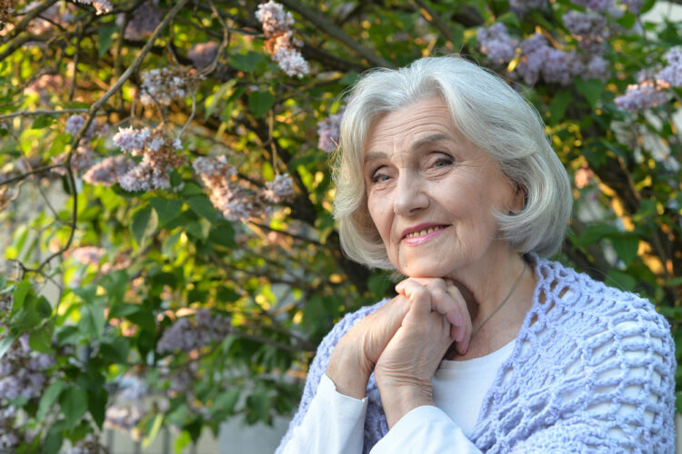 Portrait of a beautiful woman in the park in summer